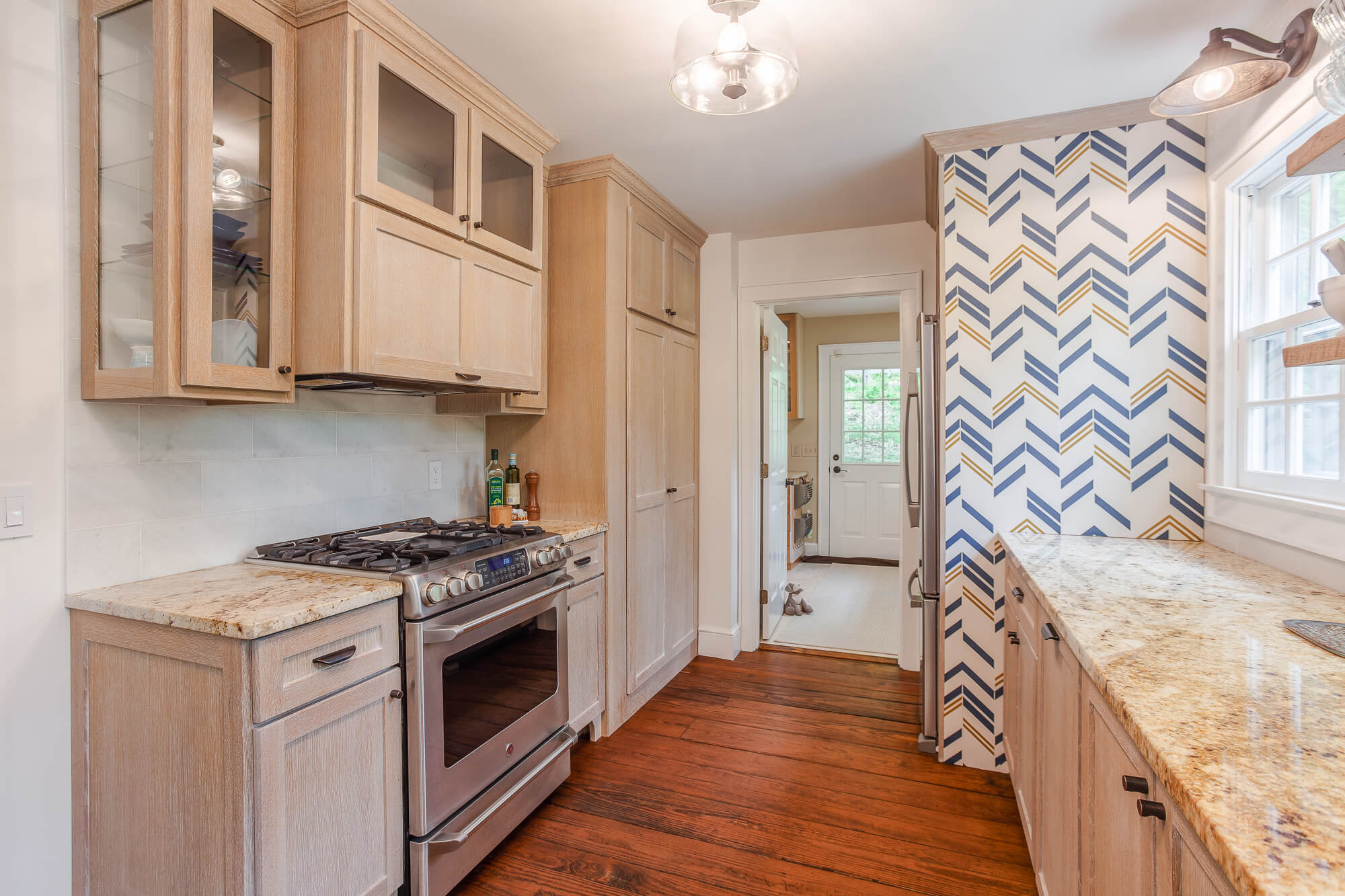 Custom cerused rift sawn white oak cabinets finished with a matte hardwax oil wood finish.