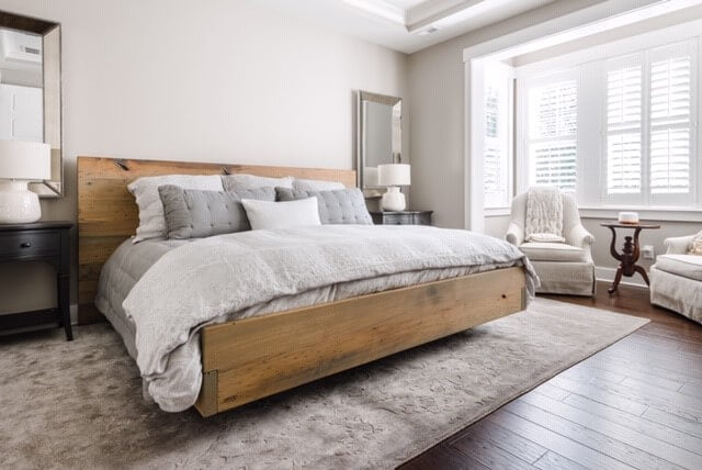 American Wormy Chestnut bedframe in a master bedroom.