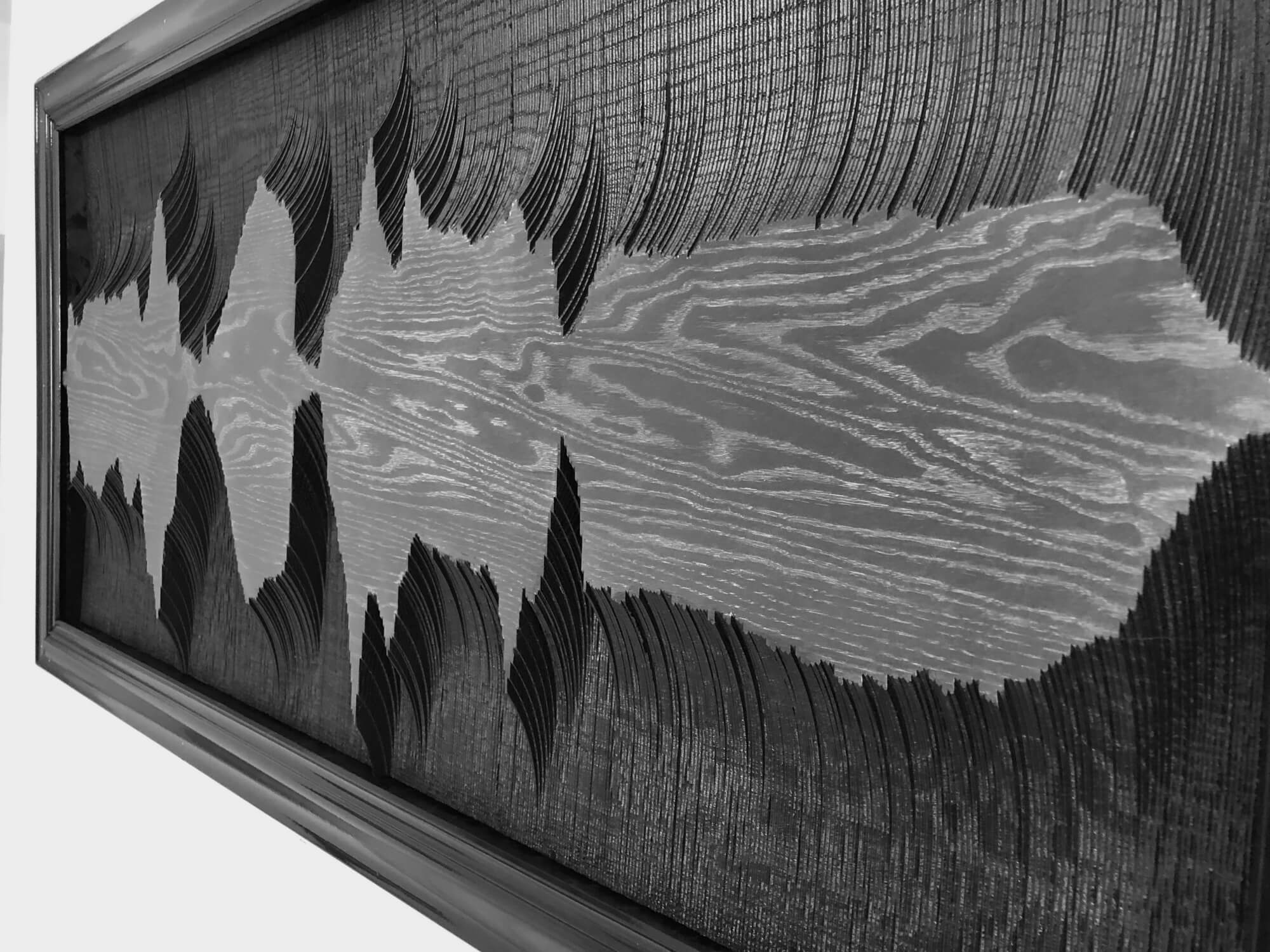 Black colored sound wave wood art.