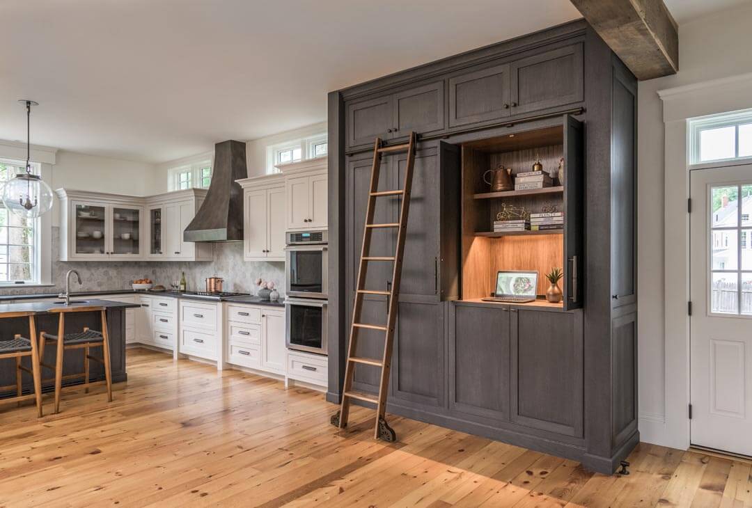 Custom stained rift and quartered white oak cabinetry in a kitchen.