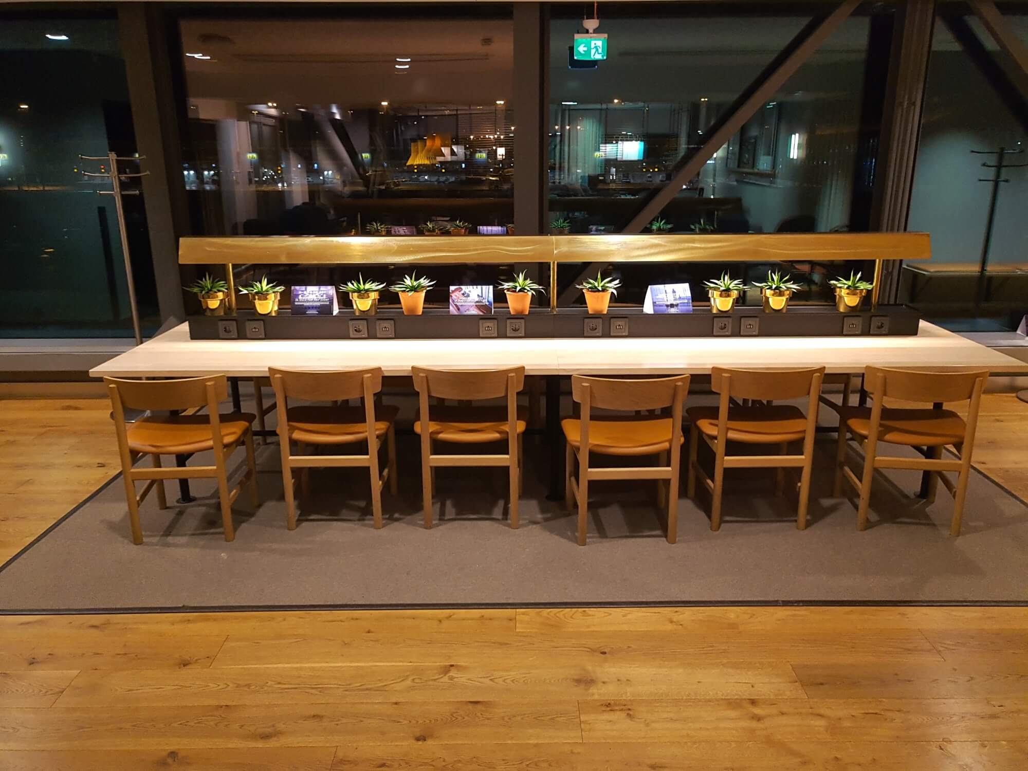 Hardwood flooring in a lounge with a table.