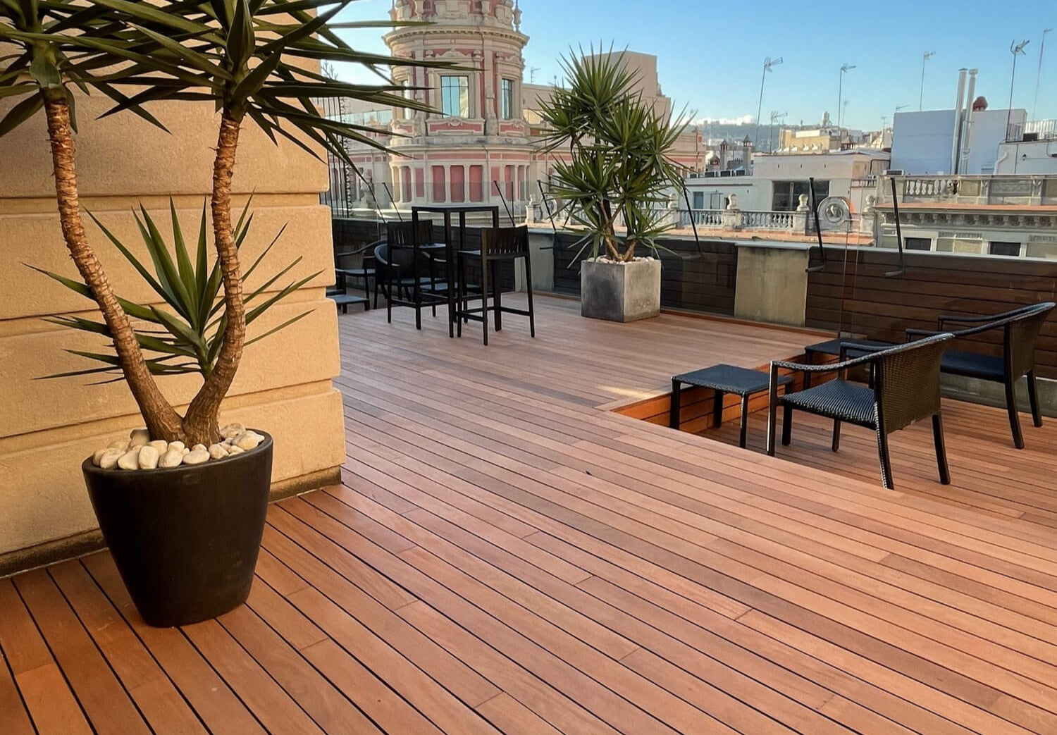A rooftop terrace with wood decking finished with an extremely durable exterior wood finish for all exterior wood projects called DuroGrit.