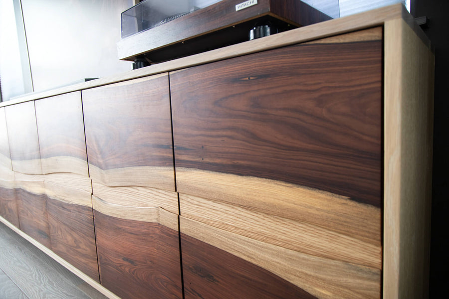 A Bolivian rosewood and white oak record storage console table.