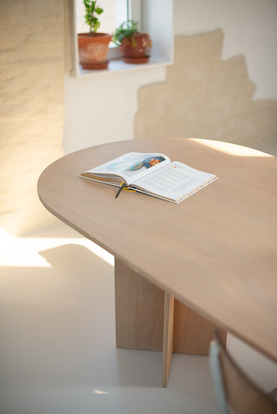 A wood table finished using Rubio Monocoat Oil Plus 2C in a light, natural color. 