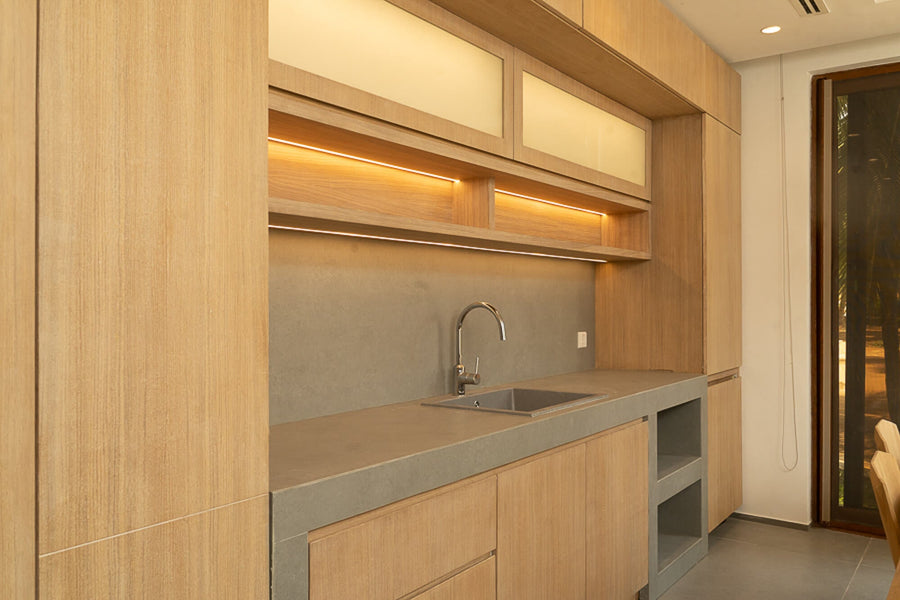 Oak veneered cabinetry in a beach villa finished using Oil Plus 2C hardwax oil wood finish.