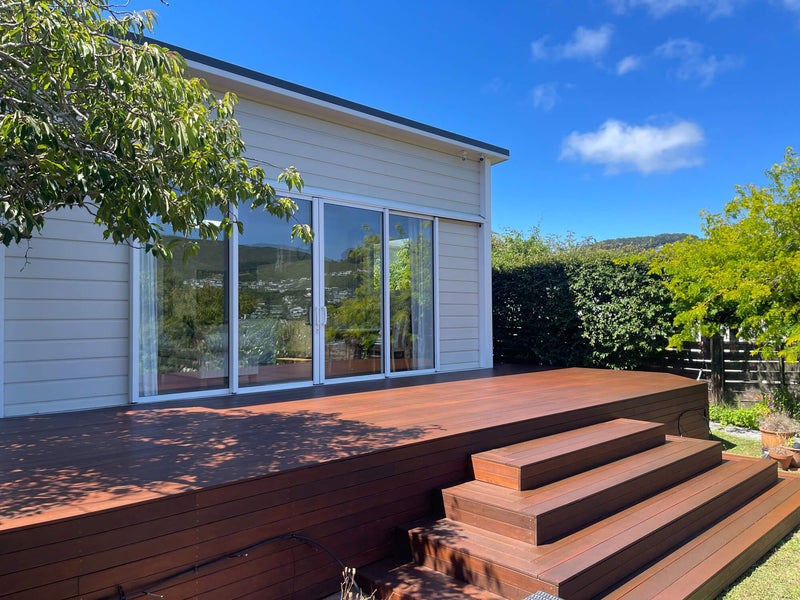 A beautiful wooden deck made from kwila wood that was colored and protected using Rubio Monocoat DuroGrit outdoor wood finish.