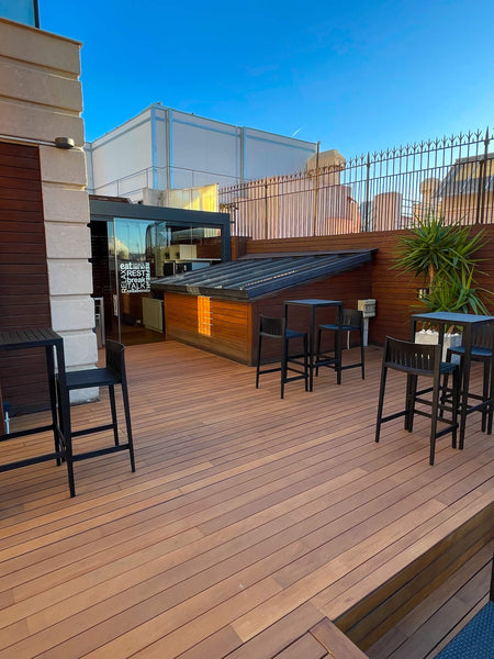 An entertainment hub, this rooftop terrace is such a welcoming social location! To handle all of the foot traffic, Rubio Monocoat DuroGrit was used to color and protect it!