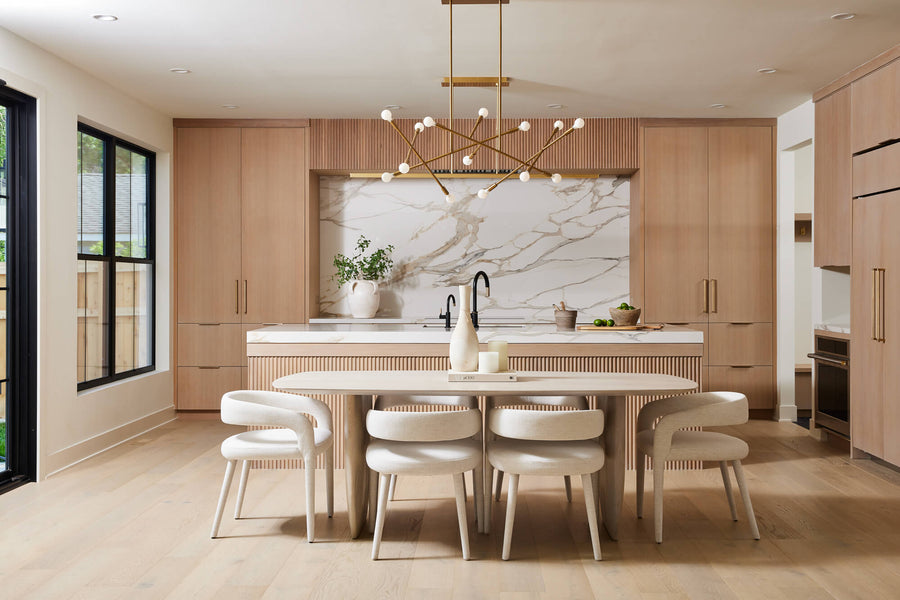 A modern kitchen with floor to ceiling cabinetry crafted from white oak and finished using Rubio Monocoat Oil Plus 2C "Cornsilk".