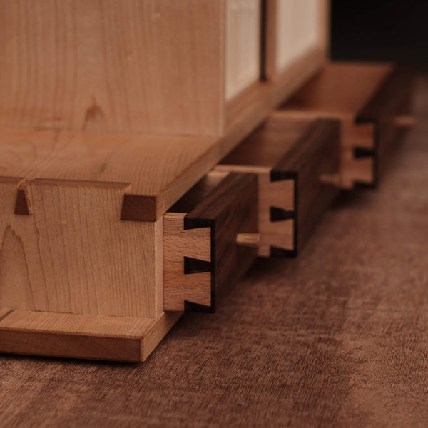 Dovetail details on maple and walnut drawers on a tea cabinet finished using Rubio Monocoat Oil Plus 2C hardwax oil wood finish for interior use.