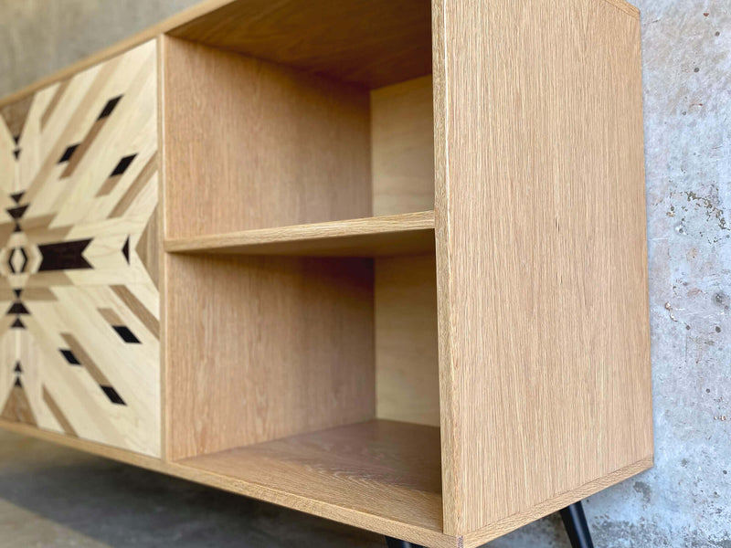 Shelves in a custom credenza made from solid maple, white oak, and wenge.